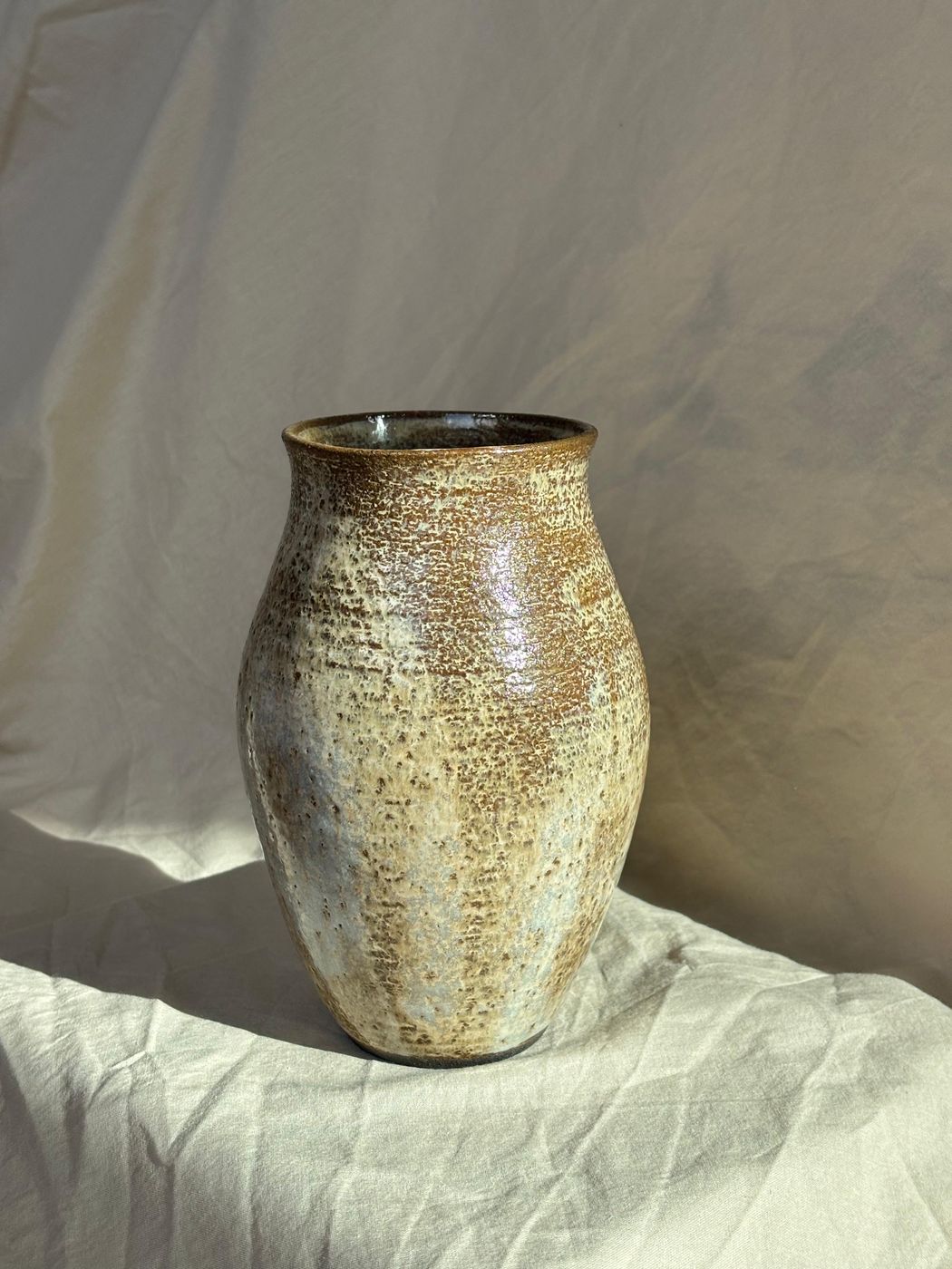 Rounded stoneware vase, brown and cream glaze
